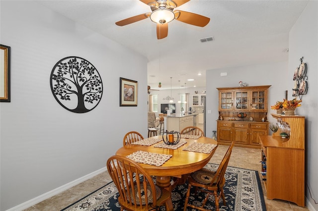 dining area with ceiling fan