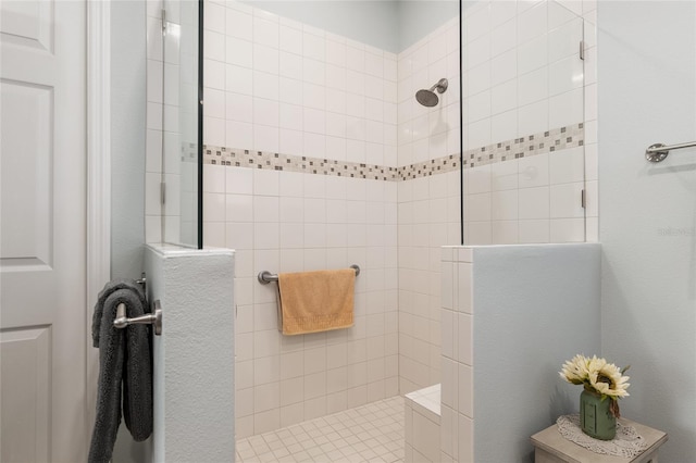 bathroom featuring a tile shower