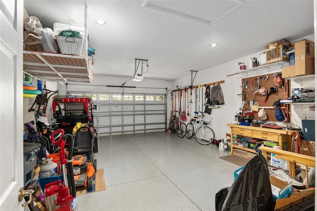 garage featuring a workshop area and a garage door opener