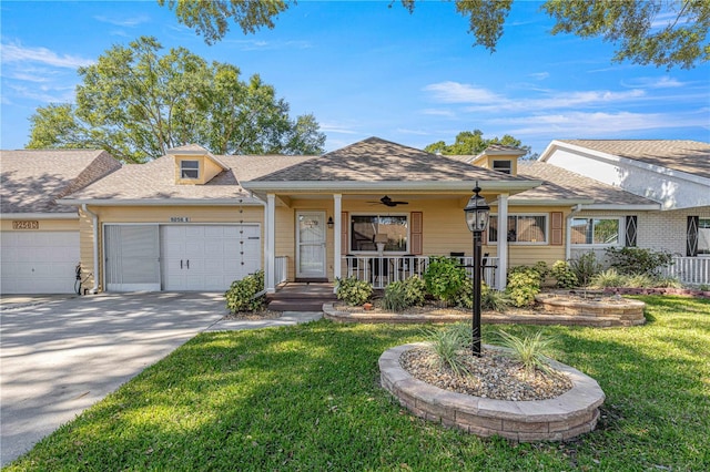 ranch-style house featuring a porch, a front lawn, and a garage