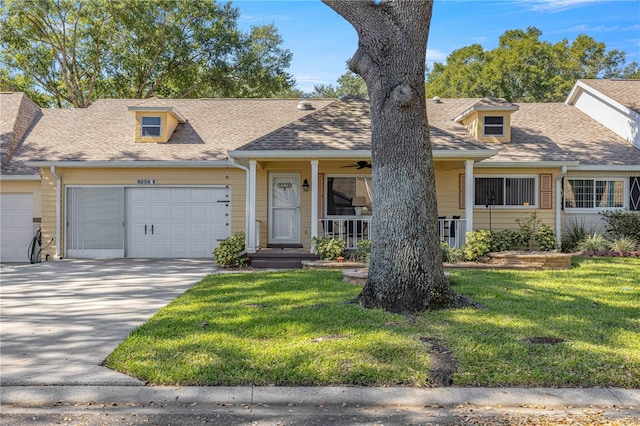 view of front of house featuring a garage and a front lawn