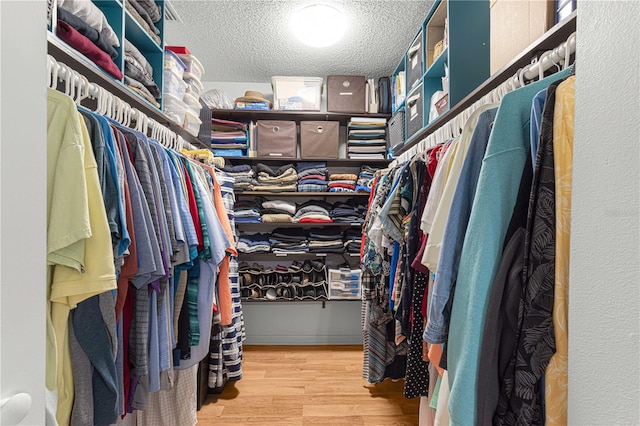 walk in closet featuring light hardwood / wood-style floors