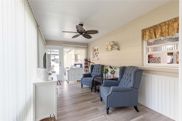 sitting room featuring light hardwood / wood-style flooring and ceiling fan