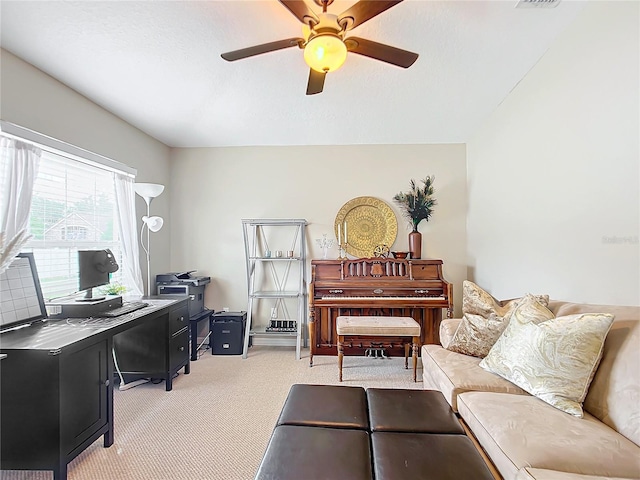 office area with light colored carpet, a textured ceiling, and ceiling fan