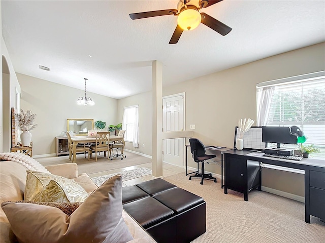 living room with light colored carpet, lofted ceiling, and ceiling fan with notable chandelier