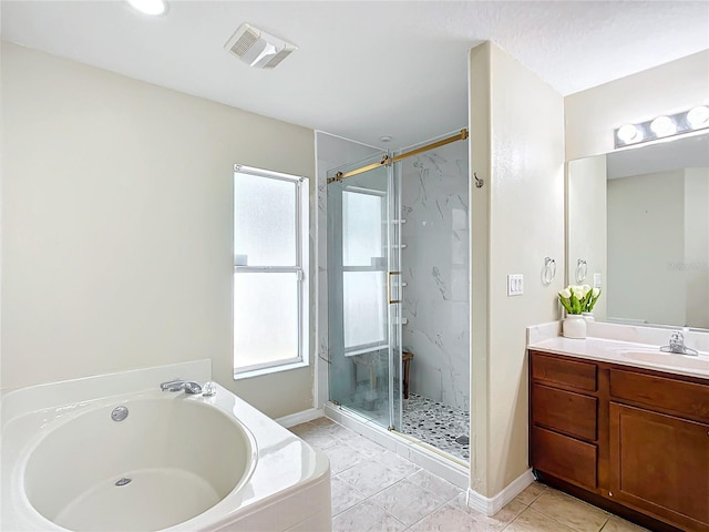 bathroom featuring vanity and shower with separate bathtub