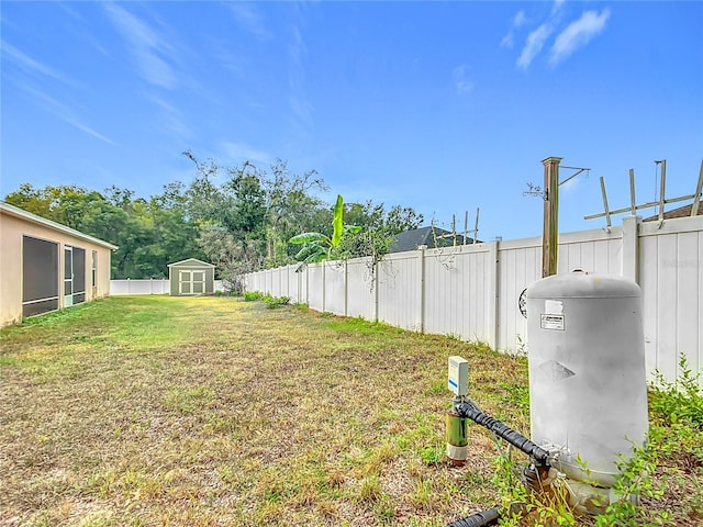 view of yard featuring a storage unit