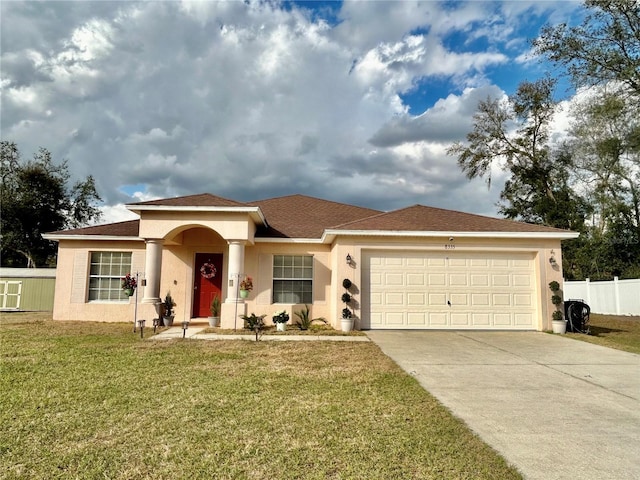 view of front of home with a garage and a front yard