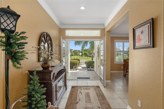 tiled entryway featuring ornamental molding