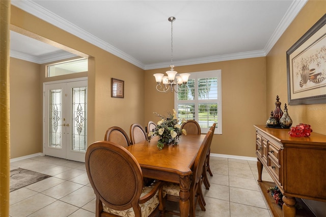 dining room with french doors, ornamental molding, and light tile patterned floors