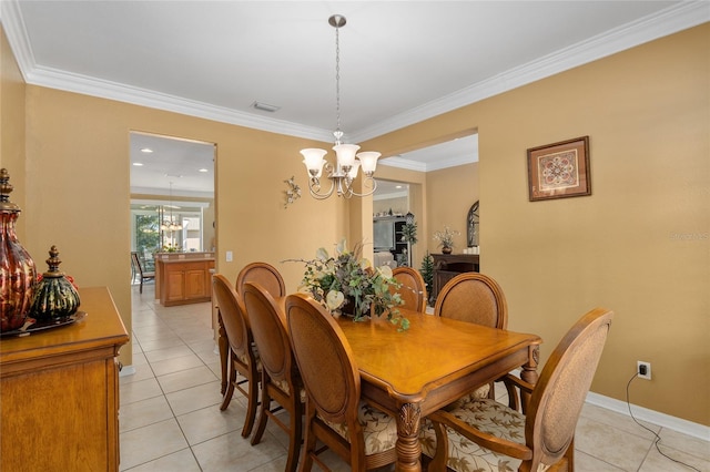 dining area featuring ornamental molding, a notable chandelier, and light tile patterned floors