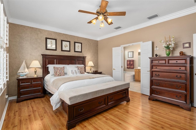 bedroom with light hardwood / wood-style floors, ornamental molding, ensuite bath, and ceiling fan