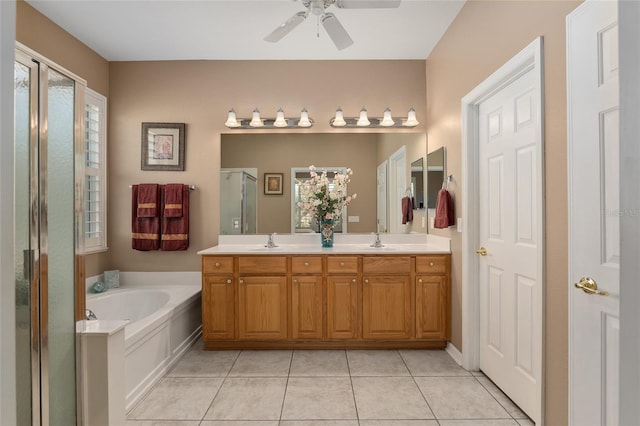 bathroom featuring vanity, independent shower and bath, ceiling fan, and tile patterned floors