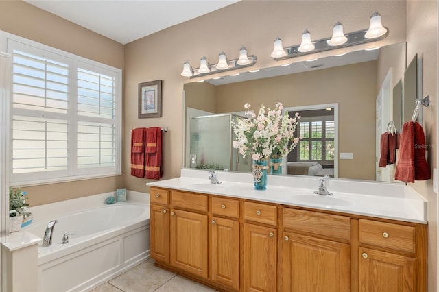 bathroom featuring vanity, tile patterned floors, and shower with separate bathtub