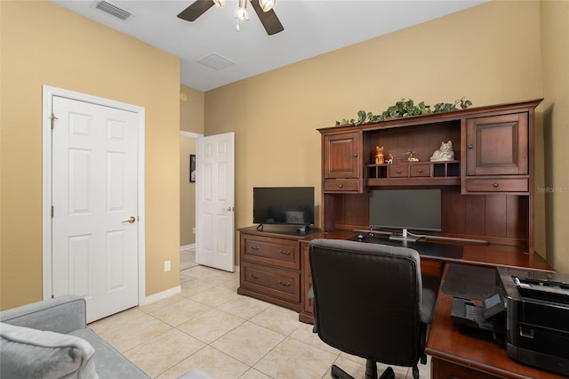 home office featuring light tile patterned flooring and ceiling fan