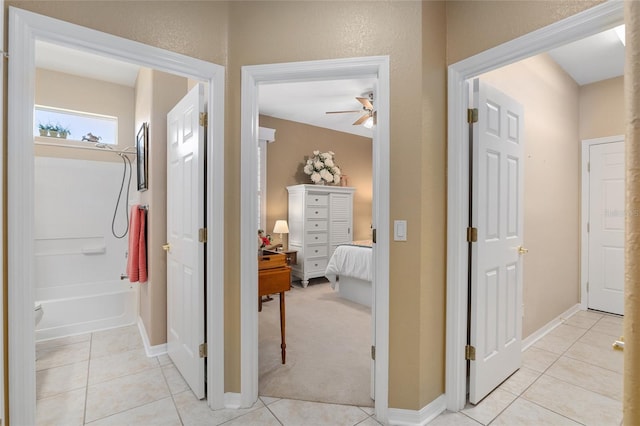 corridor featuring light tile patterned flooring