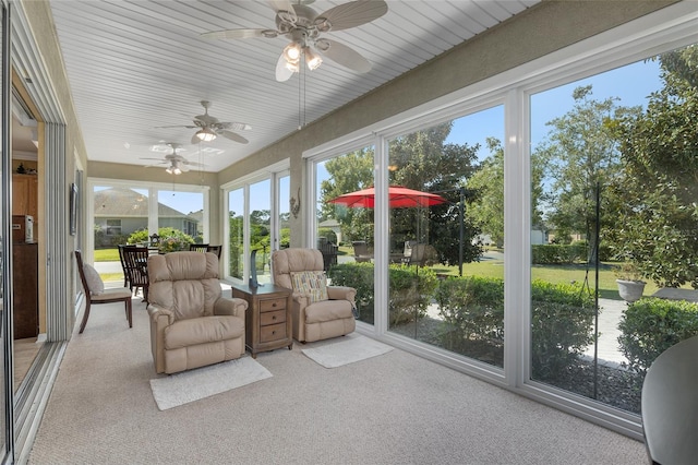 sunroom / solarium with ceiling fan