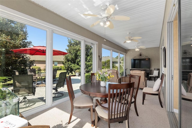 sunroom / solarium with ceiling fan