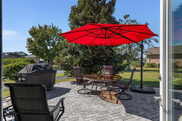 view of patio with a grill