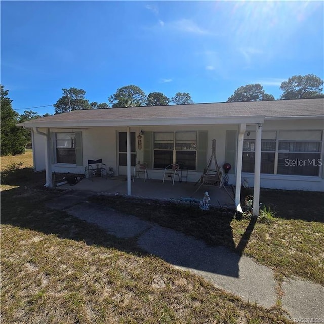 rear view of house featuring a patio area