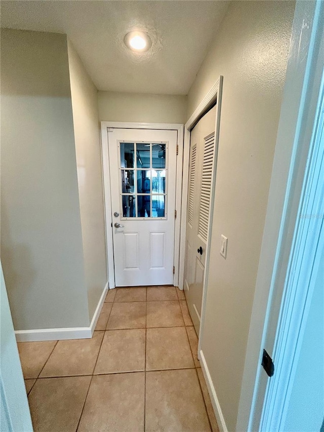 entryway featuring light tile patterned floors