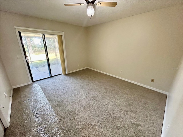 empty room with carpet flooring and ceiling fan