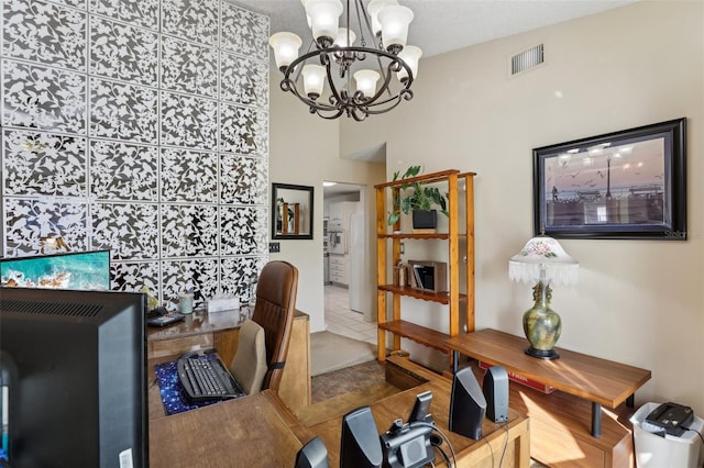 office space with tile patterned flooring and a chandelier