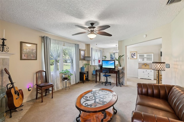 living room with a textured ceiling, ceiling fan, and light carpet