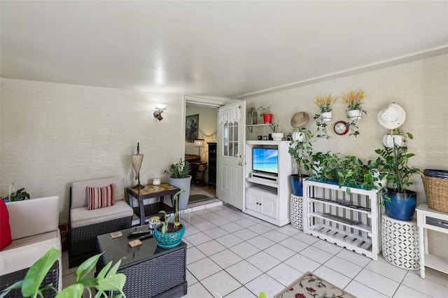 living room with light tile patterned floors