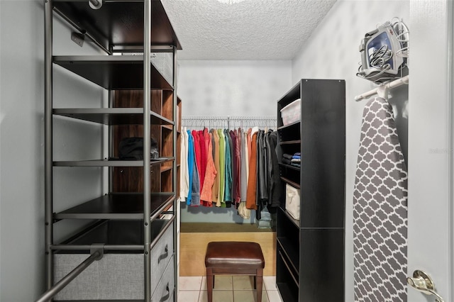 spacious closet featuring tile patterned floors