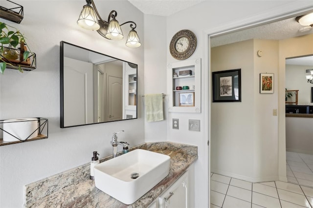 bathroom with tile patterned flooring and vanity