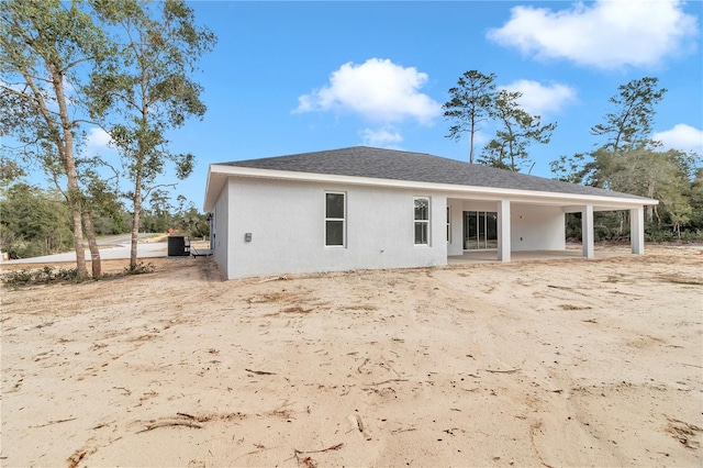 back of property featuring central AC unit