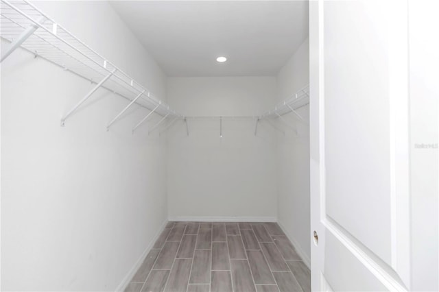 spacious closet featuring hardwood / wood-style flooring