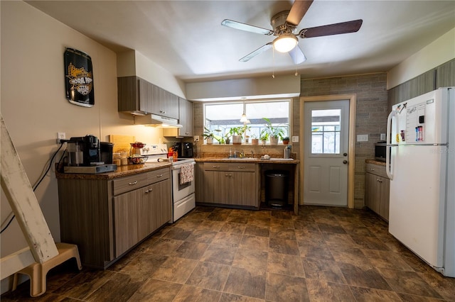 kitchen with sink, electric range, white refrigerator, tile walls, and ceiling fan