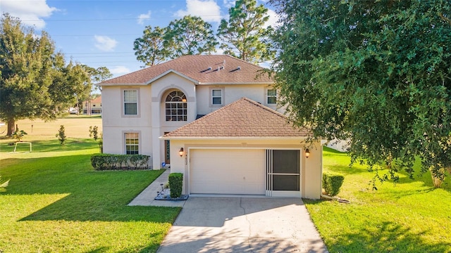 view of front of house featuring a front yard and a garage