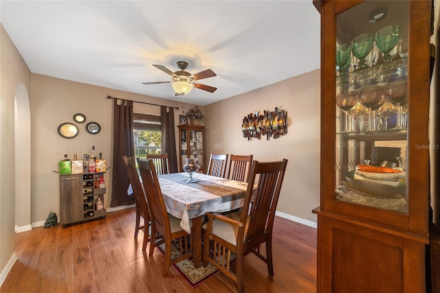 dining space featuring ceiling fan and hardwood / wood-style floors