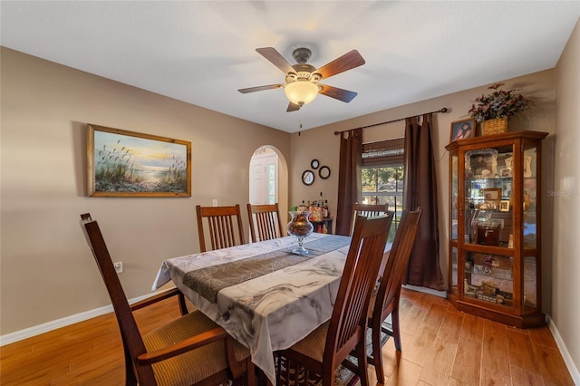 dining area featuring ceiling fan and light wood-type flooring