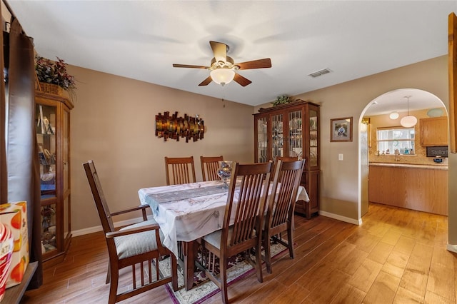 dining area featuring light hardwood / wood-style floors and ceiling fan