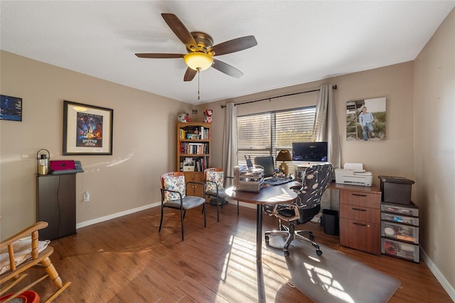 office area featuring ceiling fan and dark hardwood / wood-style flooring