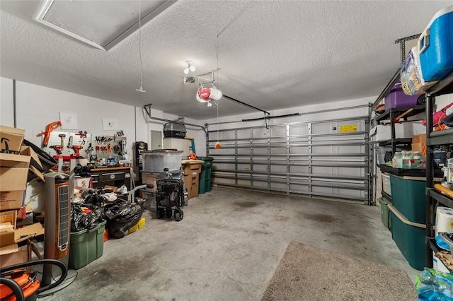 garage with a garage door opener and a workshop area