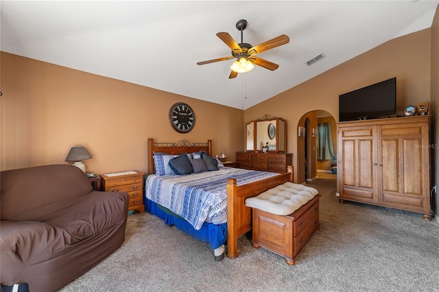 bedroom featuring light carpet, vaulted ceiling, and ceiling fan