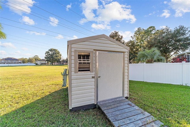 view of outdoor structure with a yard