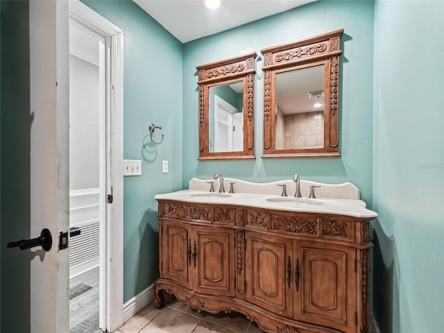 bathroom with vanity and tile patterned floors