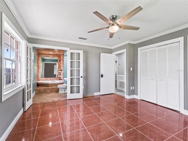 unfurnished bedroom with french doors, ornamental molding, a closet, and ceiling fan