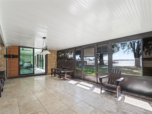 sunroom with a water view