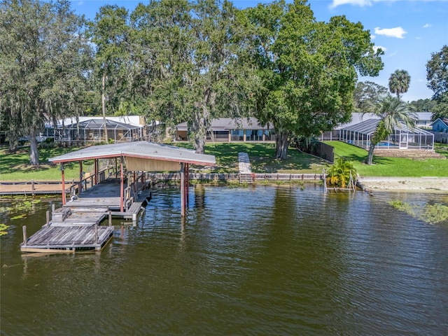 dock area with a water view and a lanai