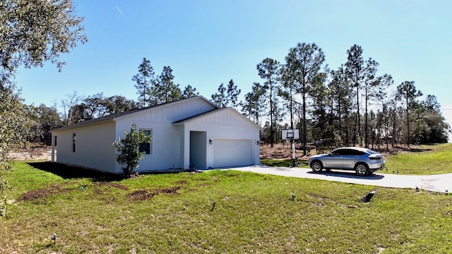 exterior space featuring concrete driveway, a lawn, and an attached garage