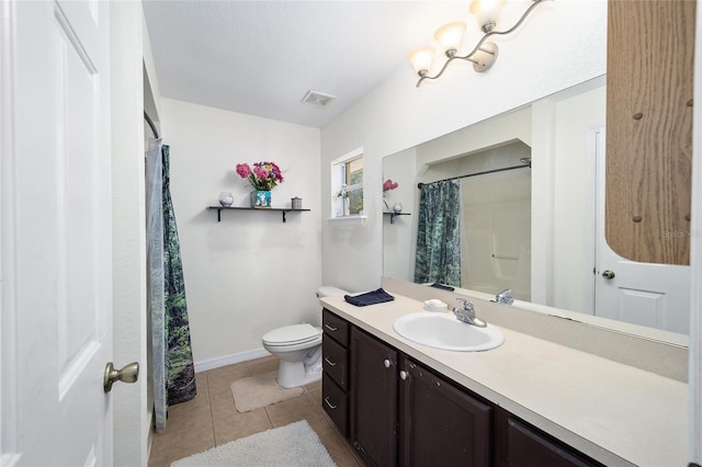 bathroom featuring vanity, walk in shower, toilet, and tile patterned floors