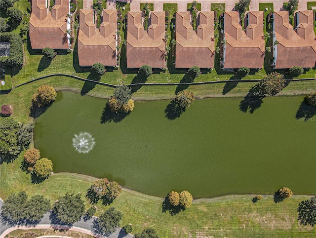 birds eye view of property with a water view and a residential view