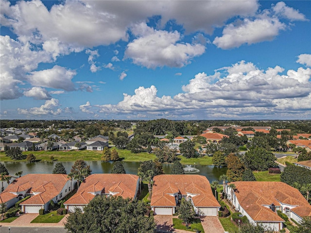 birds eye view of property with a water view and a residential view